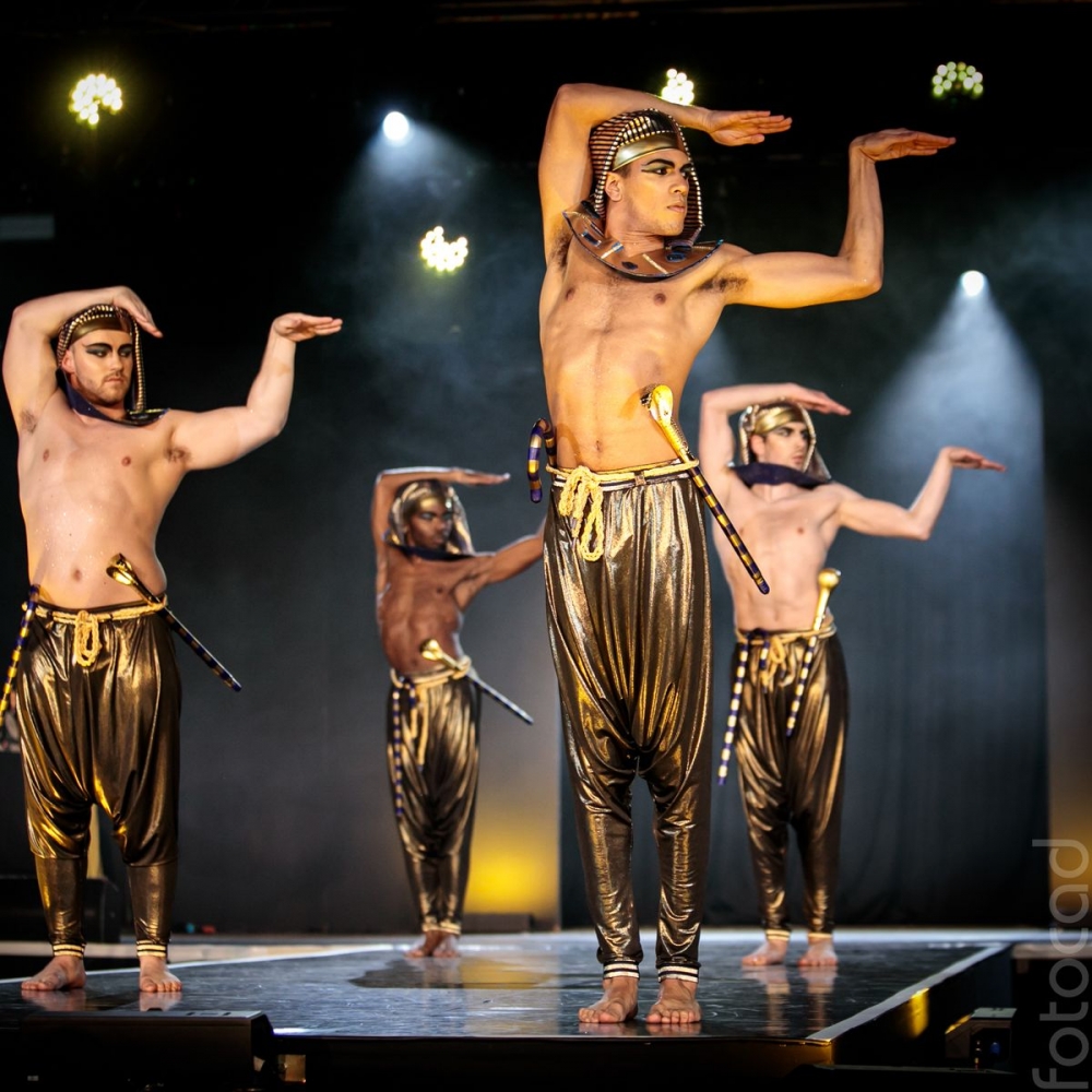 4 Dancers stand on stage in historical Egyptian inspired costume at the 2022 House of Suarez vogue ball