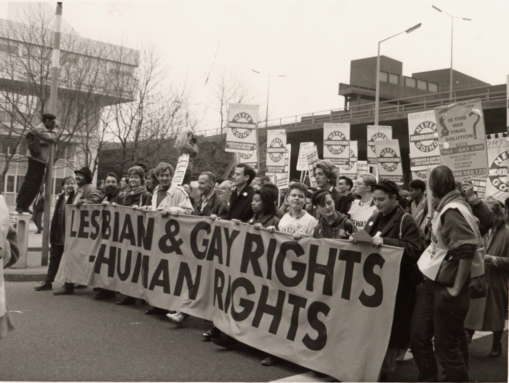 A group of young people, all holding a huge banner which reads 'Gay and Lesbian Human Rights'